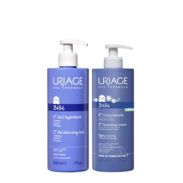 Le Kit Coffret Uriage Mes Premiers Soins Bébé + DOUDOU OFFERT comprend deux flacons pompe - 1er Lait Hydratant et 1ère Crème Nettoyante - dans un packaging bleu avec un texte blanc et de jolies illustrations d'ours. Dakar