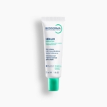 Un tube blanc de Bioderma SEBIUM KERATO+ Gel-Crème Anti-Imperfections pour peaux à tendance acnéique, 30ml, avec un bouchon vert se tient debout sur un fond blanc. Dakar