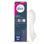 Une boîte de 100 ml de crème dépilatoire Veet « Bikini et Aisselles » pour poils résistants, à base de beurre de karité, dans un emballage bleu et rose, accompagnée d'une spatule blanche incurvée. Dakar