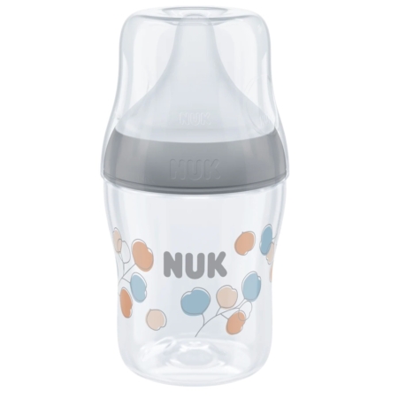 Le biberon NUK Perfect Match Gris 150 ml pour bébés de 0 à 6 mois est doté d'une tétine en silicone souple, d'un couvercle gris et est décoré de motifs de ballons bleus, orange et beiges ainsi que du logo « NUK » sur le devant. Dakar