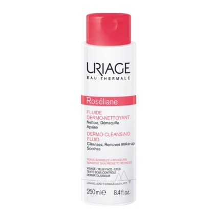 Le Fluide Dermo Nettoyant Roseliane d'URIAGE 250 ml est doté d'un flacon blanc épuré avec une étiquette rouge. Ce nettoyant doux démaquille efficacement et apaise les peaux sensibles, offrant un soin délicat optimal. Dakar