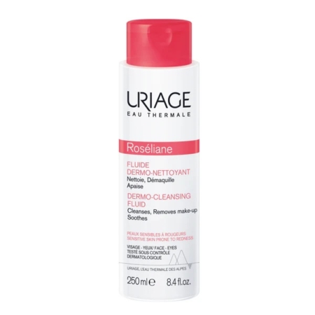 Le Fluide Dermo Nettoyant Roseliane d'URIAGE 250 ml est doté d'un flacon blanc épuré avec une étiquette rouge. Ce nettoyant doux démaquille efficacement et apaise les peaux sensibles, offrant un soin délicat optimal. Dakar
