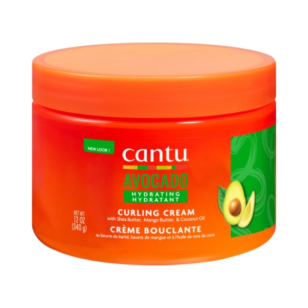 Pot orange vif de Crème Bouclante Hydratante à l'Avocat Cantu 340 g. L'étiquette présente du beurre de karité, du beurre de mangue et de l'huile de coco, avec une image d'avocat sur le côté droit. Poids : 340 g. Dakar