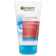 Tube de Garnier PureActive Sensitive Gel-Crème Purifiant sans Savon 150 ml, idéal pour les peaux grasses à tendance acnéique. Enrichi en acide salicylique et en extrait de myrtille, il cible efficacement les boutons et les points noirs. Le packaging est orné de blanc avec des détails bleus et rouges, évoquant l'énergie vibrante de Dakar, au Sénégal. Dakar