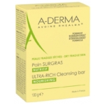 Une boîte jaune de A Derma Les Indispensables Pain Dermatologique Apaisant 100g pour les peaux sèches et fragiles, avec un texte en français et en anglais. L'emballage indique que la formule est nourrissante et biodégradable et que le produit est fabriqué en France. Dakar