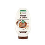 Garnier Ultra Doux Après-Shampooing Nourrissant Lait de Coco et Macadamia Flacon de 250 ml avec texte Kokos Milch & Macadamia et étiquette d'ingrédients 97% naturels