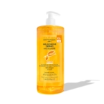 Un flacon pompe transparent de Byphasse Gel Douche Dermo Micellaire Argan 1 Litre avec étiquetage français se trouve sur un fond blanc, présentant un gel jaune-orange enrichi en huile d'argan pour un nettoyage quotidien en douceur. Dakar