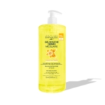 Un flacon pompe transparent de Byphasse Gel Douche Dermo Micellaire FLEUR DE TIARÉ 1 Litre, contenant un liquide jaune et comportant un graphique de fleur sur l'étiquette, se trouve sur un fond blanc avec une ombre douce. Dakar