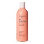 Une bouteille rose de 500 ml de Byphasse Lait Unificateur de Teint Extrait de Blé avec un bouchon à clapet blanc se dresse debout sur un fond blanc uni, avec un étiquetage français et anglais pour les soins du corps et du visage. Dakar