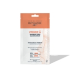 Un sachet de 1 masque en tissu « Skin Booster Illuminateur » de BYPHASSE, orné d'un motif orange et blanc, indique le nom du produit ainsi que ses bienfaits et des allégations exprimées en pourcentage concernant l'amélioration de la luminosité de la peau et l'uniformité du teint. Dakar