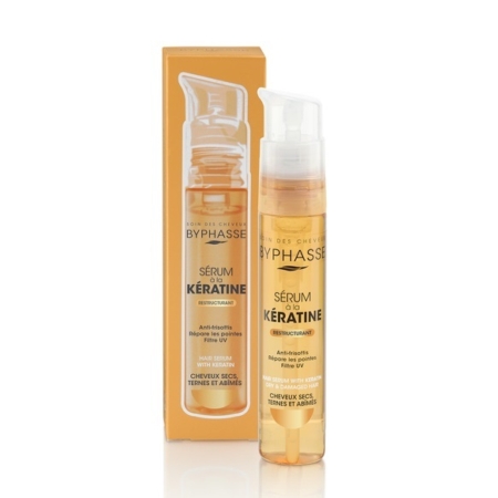 Un flacon de « Byphasse Sérum Capillaire Sublim Protect Cheveux Secs, Ternes et Abîmés » de 50 ml est posé à côté de son emballage orange vif ; tous deux affichent bien en évidence les informations relatives au produit « Byphasse Sérum » en français. Dakar