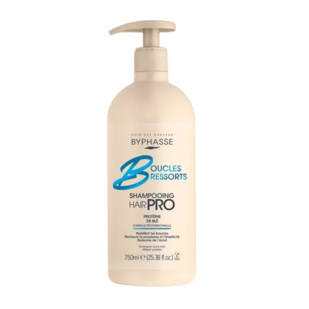 Le Shampooing BYPHASSE Boucles Ressorts Hair Pro Cheveux Bouclés 750ml se présente sous la forme d'un flacon pompe beige avec un texte bleu et marron, avec une formule professionnelle pour les cheveux bouclés. Dakar