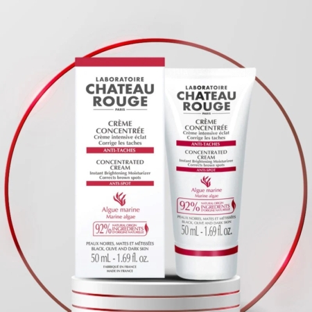 Deux tubes blanc et rouge de Chateau Rouge Crème Concentrée Anti-Taches 50ml sont présentés, le texte de l'emballage mettant en avant les effets anti-taches et éclaircissants ainsi que 92% d'ingrédients naturels. Dakar