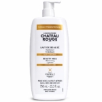 Un flacon de 750 ml de Château rouge Lait de beauté éclaircissant visage et corps à la Vitamine C, avec distributeur à pompe et texte français/anglais le décrivant comme une lotion hydratante et éclaircissante pour les peaux noires, olivâtres et métissées. Dakar