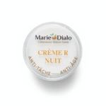 Un récipient rond et blanc étiqueté "Dr Marie Diallo Laboratoires Crème R Nuit Anti-Tache Et Anti-Age 50 ml" est représenté de haut sur un fond blanc. Dakar