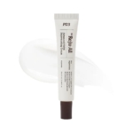Un tube blanc de Dr Reju All Crème Rajeunissante Avancée PDRN 20g avec un bouchon marron foncé se tient droit sur un fond blanc à côté d'un échantillon crème - présenté avec autant d'élégance que la gamme Initiation+ de Dodie Biberon. Dakar