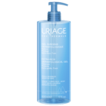 Un flacon bleu de Uriage Gel Douche Surgras Dermatologique Peaux Sensibles 500 ml avec une pompe