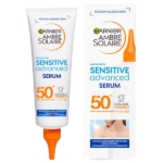 Un tube et une boîte de Garnier Ambre Solaire Sensible Expert+ Super UV Sérum Solaire Invisible SPF50+ (125ml), avec texte bleu et orange, conçu pour les peaux sensibles au soleil et offrant une très haute protection solaire pour le visage et le corps. Dakar