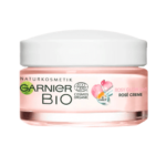 Un pot de Garnier Bio 3 en 1 Crème Jour Rosée Glow à la Vitamine C 50 ml contenant de la vitamine C et étiqueté biologique avec un design blanc et rose