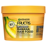 Le masque capillaire à la banane Garnier Fructis Hair Food, présenté dans un contenant jaune vif, est enrichi en vitamines C, E et F. Il contient 97 % d'ingrédients d'origine naturelle et une formule vegan. Étiqueté en allemand et en français, c'est le masque capillaire idéal pour nourrir les cheveux secs. Dakar