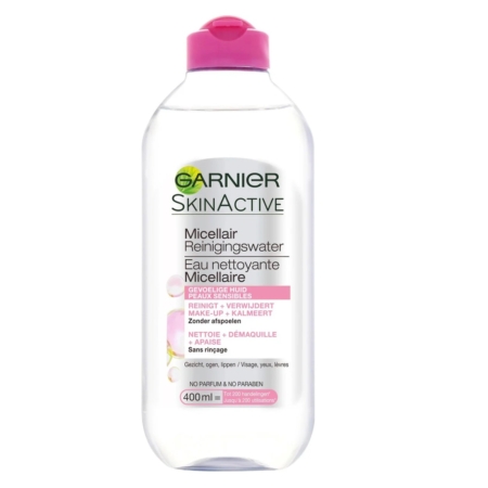 Un flacon transparent de 400 ml de Garnier SkinActive Solution Micellaire Tout En Un Tous Types de Peaux avec un bouchon rose et une étiquette multilingue, convenant à tous les types de peau. Dakar