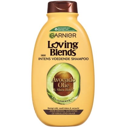 Une bouteille jaune de 300ML de Garnier Shampooing à l'Huile d'Avocat et Beurre de Karité pour les cheveux très secs, frisés ou bouclés. L'étiquette comporte des accents verts et bruns avec un texte en néerlandais. Contient de l'huile d'avocat et du beurre de karité. Dakar