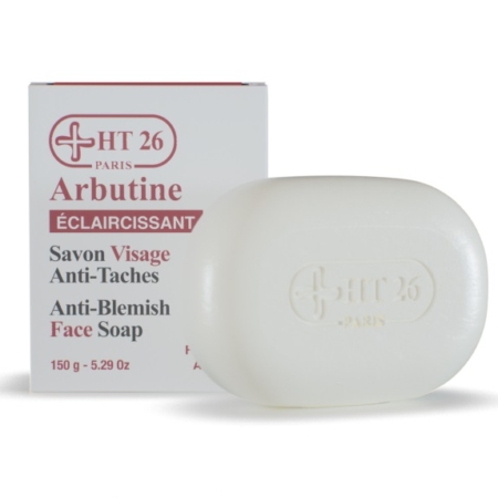 Un savon blanc HT26 Paris Arbutine (anti-imperfections, éclaircissant, 150g/5.29oz) se trouve devant sa boîte - idéal pour être associé à votre Pixi Double Glow Kit Coffret Soin Visage pour une peau radieuse. Dakar