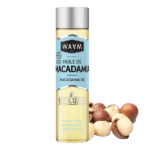 Une bouteille d'huile de macadamia étiquetée "Waam Huile Macadamia BIO 75 ml" avec des noix de macadamia à côté