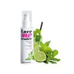 Un flacon de Love To Love Huile de Massage Gourmande Et Chauffante Mojito 100 ml d'Univers Cosmetix côtoie un citron vert