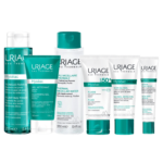 Une gamme d'Uriage Hyseac Routine Anti Boutons Et Points Noirs + Trousse OFFERT en flacons et tubes bleu sarcelle et blanc de la gamme Hyséac