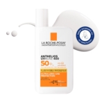 Un flacon blanc de La Roche-Posay Anthelios UVMUNE 400 Fluide Invisible SPF50+ 50ml Sans Parfum avec un texte orange et noir se trouve à côté d'une trace de produit et d'un sceau bleu "recommandé par un dermatologue". Dakar