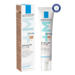 Un tube et une boîte blancs de La Roche-Posay Effaclar Duo Unifiant Teinte Medium 40ml, accentués de bleu et de beige, étiquetés comme soin teinté anti-imperfection pour les peaux à tendance acnéique avec points noirs. Dakar