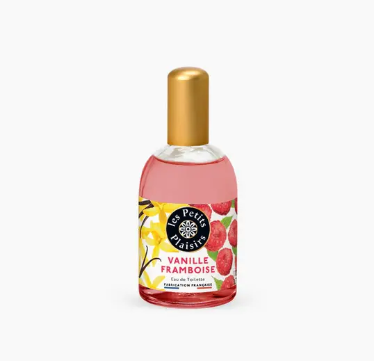 Un flacon de 110 ml de « Les Petits Plaisirs Eau de toilette Vanille Framboise » présente un capuchon doré et une étiquette au design floral-fruité