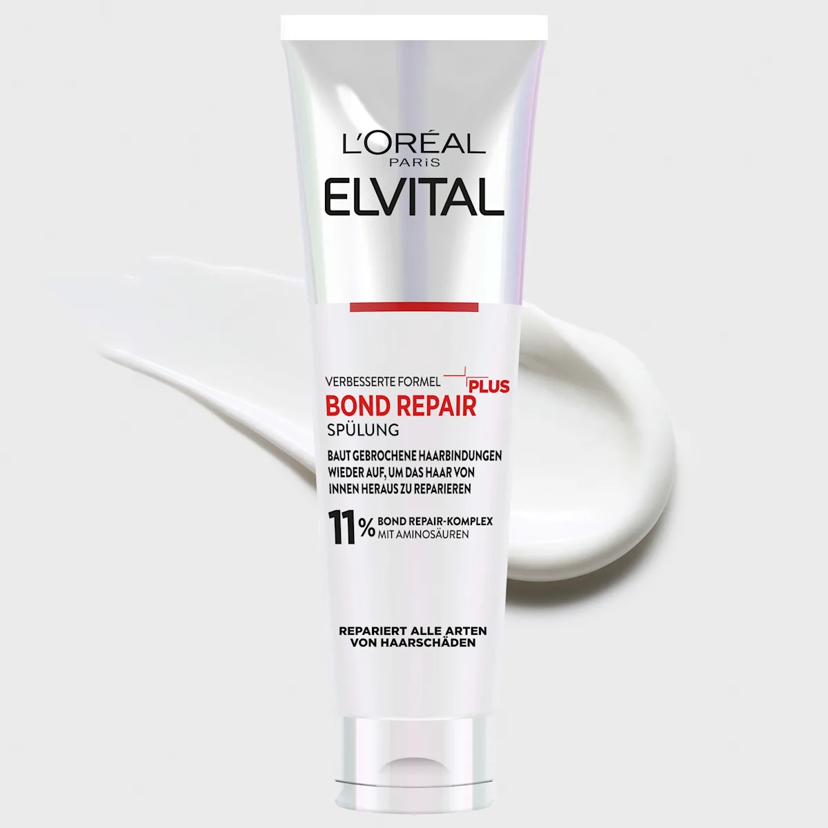 Un tube de L'Oréal ElvitalL Après Shampoing Réparateur Cheveux Abîmés 150 ml se tient debout sur un fond gris clair, avec une trace blanche derrière lui. L'emballage met en avant le complexe réparateur de 11% et les allégations de réparation. Dakar