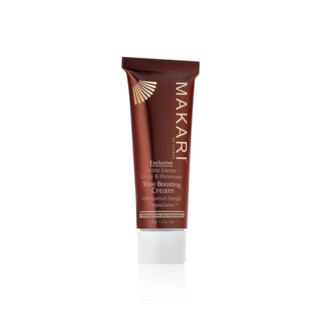 Un tube brun de Makari Exclusive Crème Visage pour Teint Éclatant 50g se tient debout sur un fond blanc, avec un texte or et blanc. Dakar