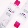 Un flacon de BYPHASSE Solution Micellaire Démaquillante pour les peaux sensibles, sèches, irritables et sujettes aux rougeurs. L'étiquette met en avant « 4 en 1 » et « peau nette ». Le flacon, doté d'un bouchon rose distinctif, est positionné à côté d'un autre, créant un effet miroir. Dakar