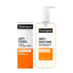 Le Pack Essentiel Anti Boutons Nettoyant + Crème Visage de Neutrogena comprend une crème anti-acné en boîte et un gel nettoyant en flacon-pompe, tous deux accompagnés d'ingrédients clés et d'instructions en allemand et en français. Dakar