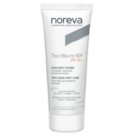 Tube de Noreva Trio White XP Soin Anti-Taches Spf50+ 40 ml avec texte en français et en anglais sur l'emballage blanc