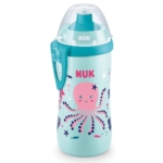 Une tasse d'apprentissage anti-fuites Nuk Junior Cup Caméléon « 18 mois et plus » de couleur turquoise, d'une contenance de 300 ml, ornée d'un motif représentant une pieuvre rose, des poissons et des algues, avec un couvercle bleu sarcelle, un capuchon transparent et un clip latéral bleu. Dakar