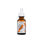 Un flacon compte-gouttes marron étiqueté "Tiam Sérum Surprise Vitamine C 24 Pure Eclat et Anti Age 30 ml" sur fond blanc