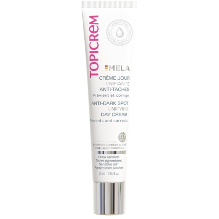 Le tube de 40 ml de Topicrem Mela Crème Correctrice Jour SPF50 est présenté dans un emballage blanc avec un texte rose, noir et argenté. Il offre une protection et un soin aux peaux sensibles et aux problèmes de pigmentation. Dakar