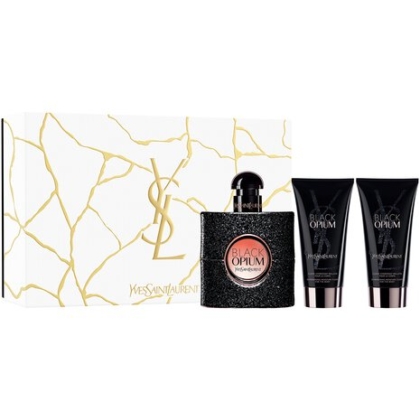 Le coffret Fêtes Black Opium Eau de Parfum comprend un flacon de parfum captivant et deux tubes assortis. Il est élégamment emballé en blanc avec le logo YSL doré emblématique et des lignes dorées abstraites, incarnant le luxe et l'art moderne. Dakar