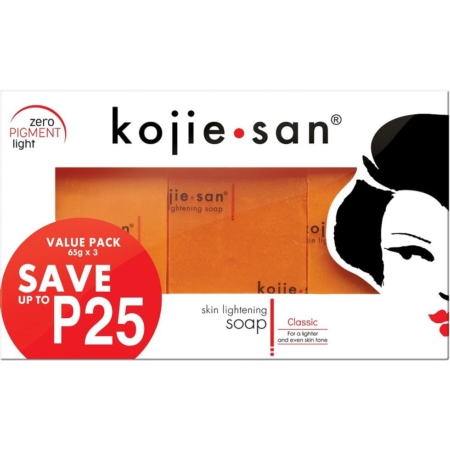 L'emballage du Kojie San Savon Unifiant Anti Taches Tous les Types de Peaux 3x65g comporte trois barres orange vibrantes, avec le texte « zéro pigment light », « économisez jusqu'à P25 » et une illustration stylisée du visage d'une femme. Dakar