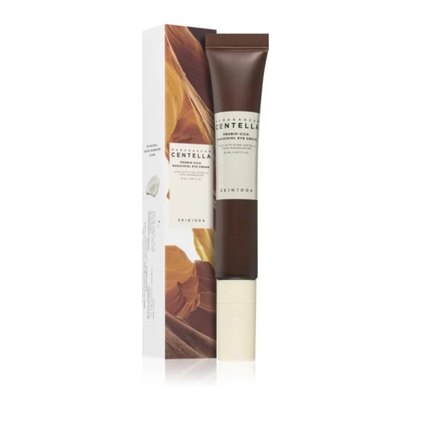 Un tube de SKIN1004 Madagascar Centella Probio Cica Bakuchiol Crème Yeux Anti Rides Effets Apaisants 20 ml se trouve à côté de sa boîte, mettant en valeur des formations en forme de canyon dans des tons bruns. Le tube est marron avec du texte blanc et noir. Dakar