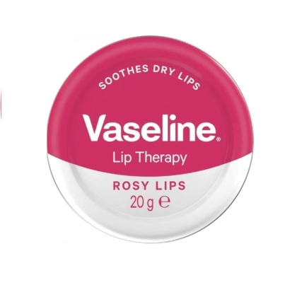 Flacon rond de VASILINE Lip Therapy - Baume Hydratant pour Lèvres en Lèvres Rosées. Le couvercle rose et blanc porte l'inscription « Apaise les lèvres sèches » et « 20 g e. Dakar