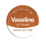Une boîte ronde étiquetée « VASILINE Lip Therapy - Baume Hydratant pour Lèvres - Beurre de Cacao 20g » présente un design orange et blanc avec le texte suivant : « Aide à guérir les lèvres sèches. Dakar