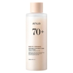 Le Tonique Laiteux Éclaircissant Rice 70+ Ceramide Glow Milky d'Anua 250 ml contient de l'extrait de riz et de la céramide pour une texture laiteuse et une hydratation légère. Le flacon opaque avec bouchon à vis beige contient 250 ml, enrichi en Essence Réparatrice KSECRET SÉOUL 1988. Dakar