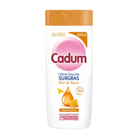 Un flacon blanc et orange de 400 ml de Cadum Crème Douche Surgras Miel de Fleurs, avec des images de miel, offre une nutrition 24 heures sur 24 à partir d'ingrédients biologiques - une alternative à Dove pour un soin de douche doux et nourrissant. Dakar