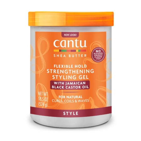 Un pot de 524 g de gel coiffant et fixant au beurre de karité Cantu, à l'huile de ricin noir de Jamaïque, pour des boucles, des ondulations et des frisottis naturels. Il est doté d'un couvercle à vis orange et d'une étiquette orange-blanc. Dakar