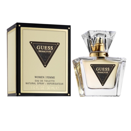 Un coffret et un flacon Guess Seductive Eau de Toilette Femme 30 ml sont présentés avec élégance. Le coffret présente des tons beiges avec des détails noirs et dorés, tandis que le flacon transparent est doté d'un bouchon doré. L'étiquette indique « Women/Femme, Natural Spray, 1,0 FL OZ / 30 mL ». Dakar